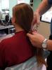 Taking the pony tail, which Nicky donated to a children's cancer charity